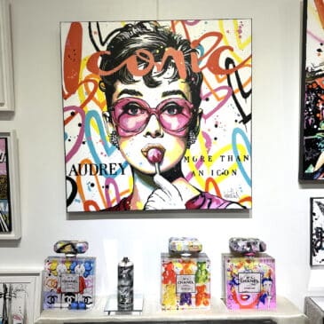 Alternative view of Audrey Hepburn, iconic with a lollipop